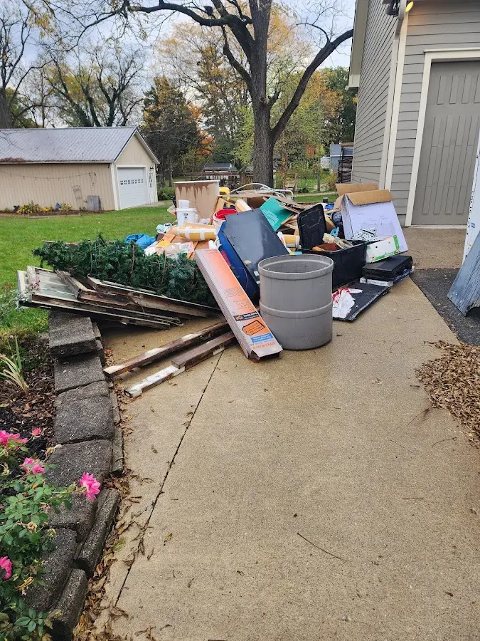 Dumpster being loaded with debris for 3 Yard Dumpster Rental in Brushy Creek